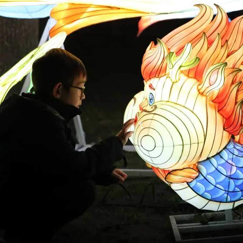 french-child-touching-chinese-lantern
